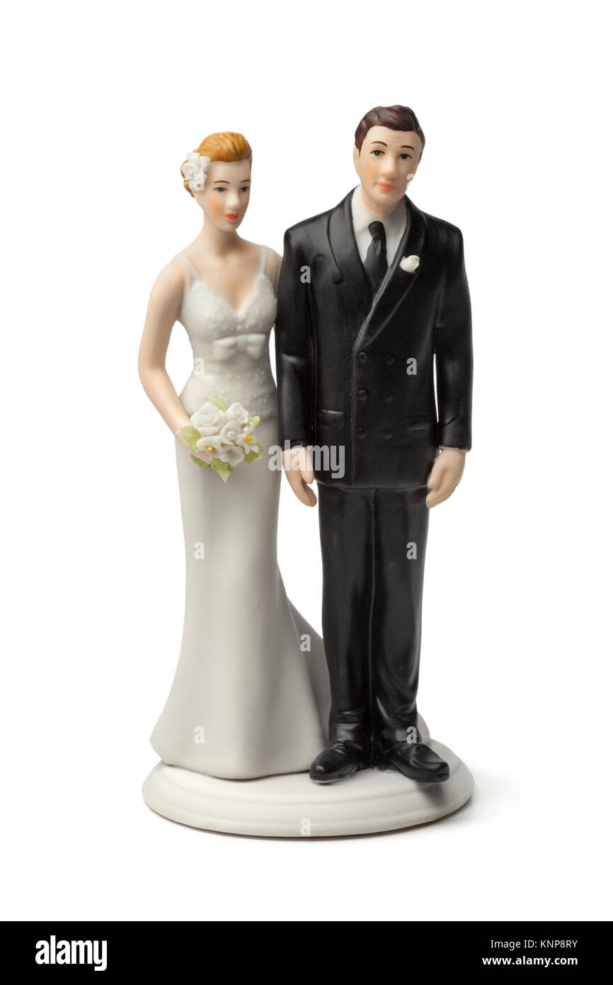 Bride and groom, old plaster cake topper on white background Stock Photo