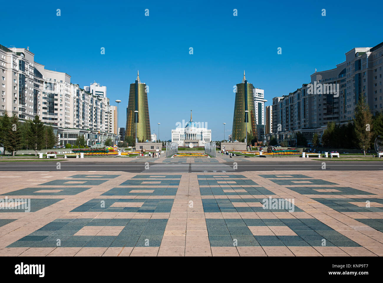 View of Nurzhol Boulevard (Green Water Boulevard) with the parliament and treasury buildings accross, in Astana, Kazakhstan. Stock Photo