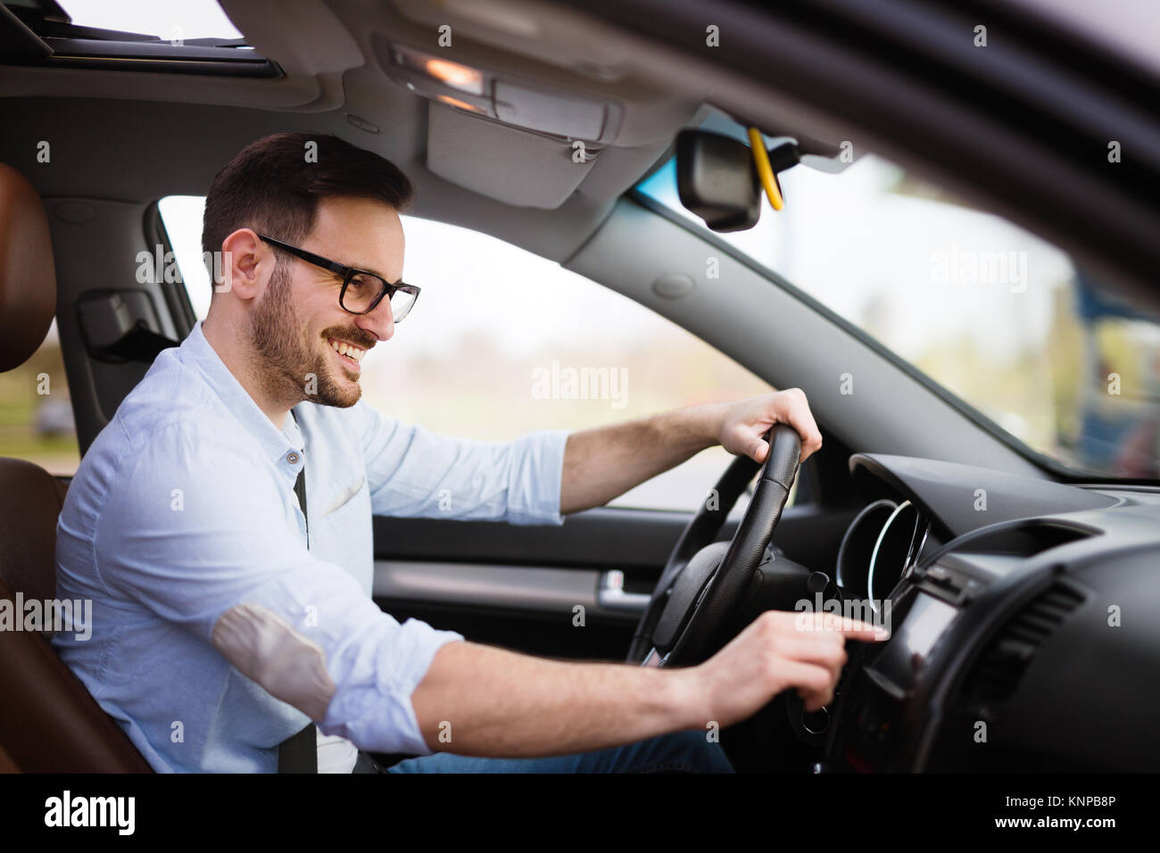 Man using navigation system while driving car Stock Photo Alamy