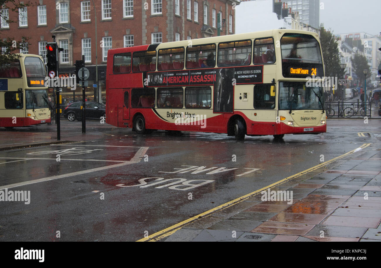 A Brighton & Hove enters a bus lane on a rainy day in Brighton Stock