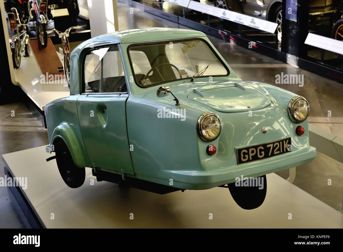 A 1971 blue  K registration AC Invacar on display at a museum in Glasgow, Scotland, UK Stock Photo