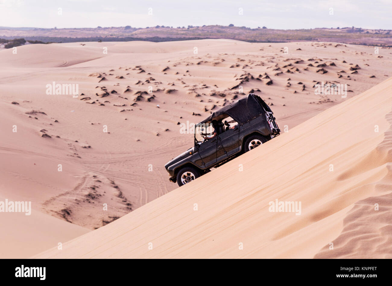 The off road drops sharply on the sand dune. Dangerous ride on the