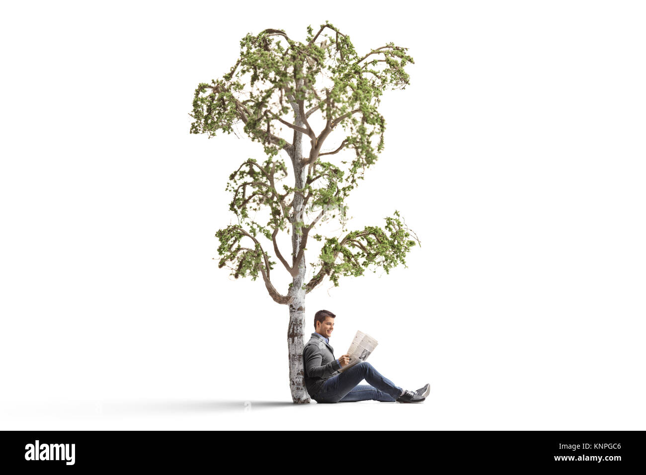 Young man reading a newspaper under a birch tree isolated on white background Stock Photo