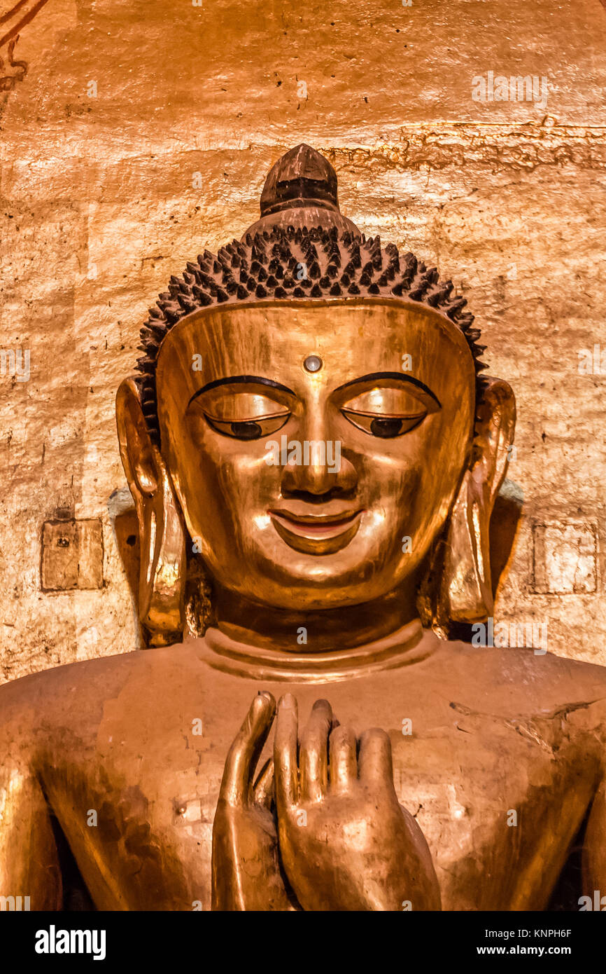 South facing standing Buddha - Kassapa, direct view of the face - look with mirthfulness, the Ananda Temple, Old Bagan, Myanmar Stock Photo