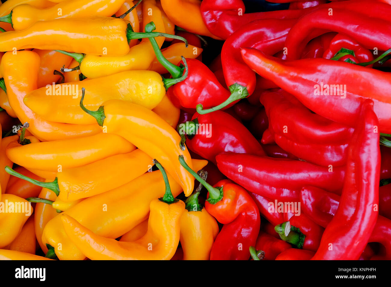 colourful yellow and red sweet peppers on market stall Stock Photo - Alamy