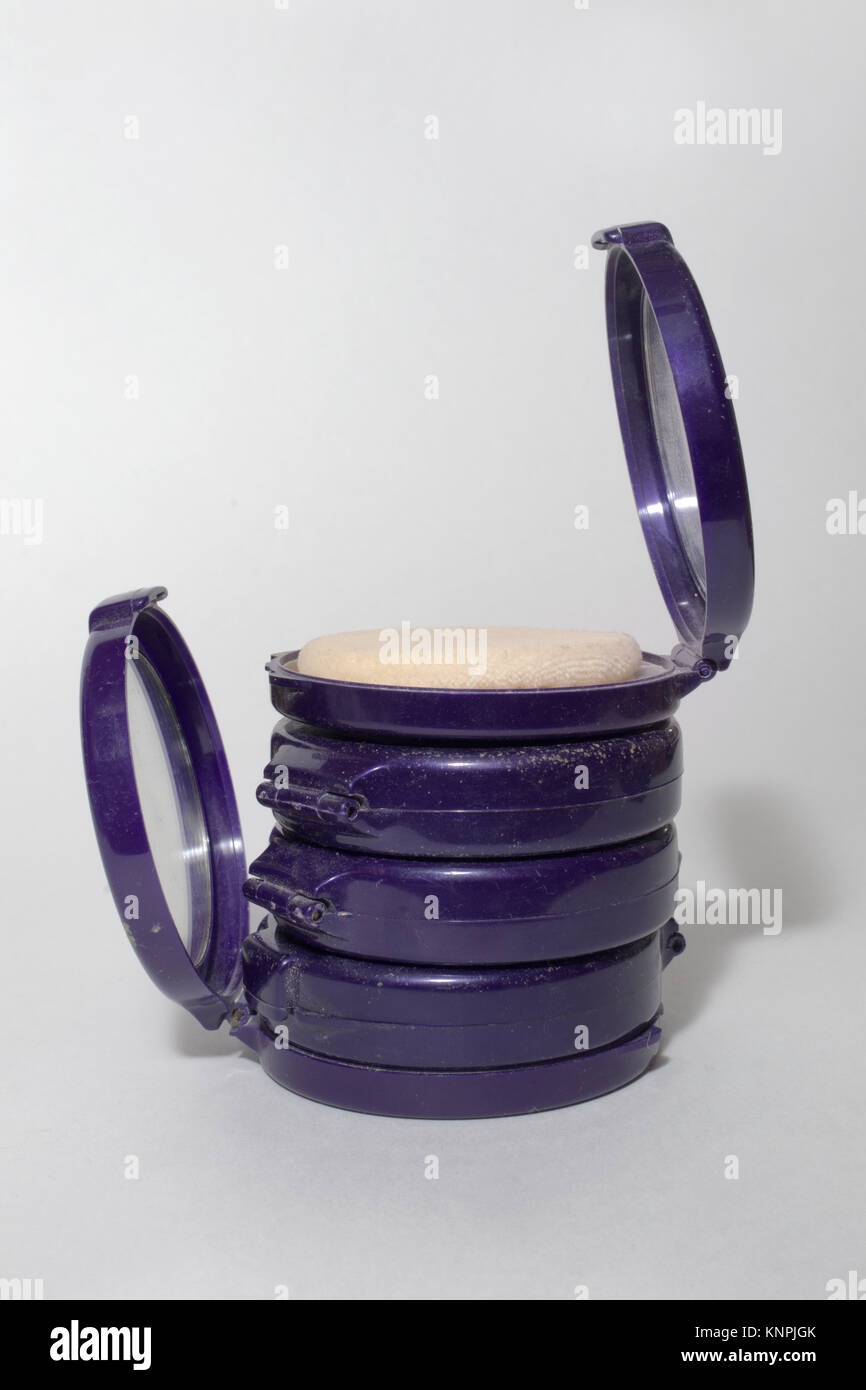 powder boxes in stack, upper with mirror and powder puff is open Stock Photo Alamy