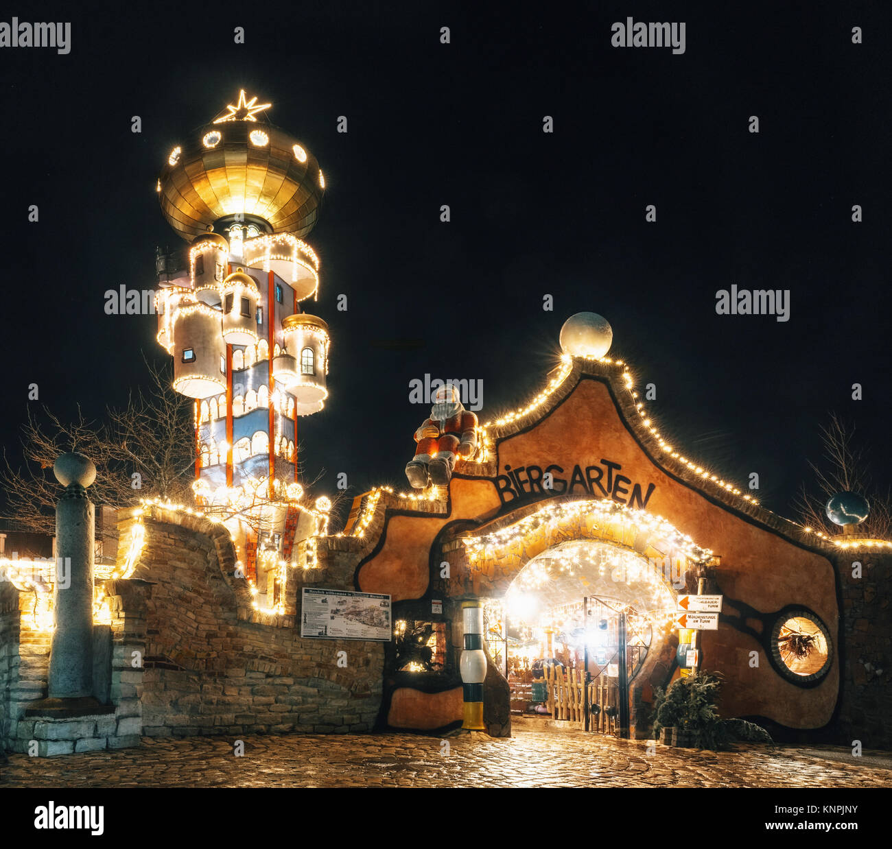 Abensberg, Germany - December 8, 2017: The tower of Kuchlbauers Beer World with Christmas illuminations and loads of shining decoration merchandise. Stock Photo