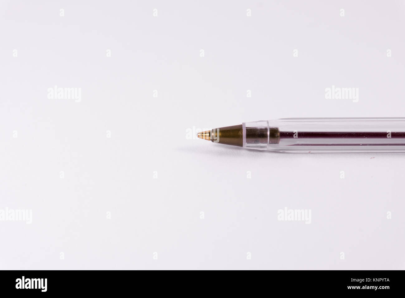 Red Pen Tip Cap Tube Plastic Clear Office Supply White Background Closeup Stock Photo