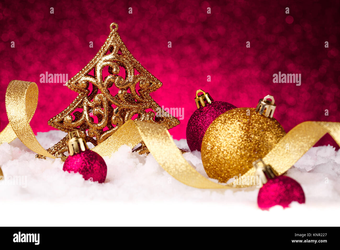 christmas fir tree decoration on red glitter background Stock Photo - Alamy