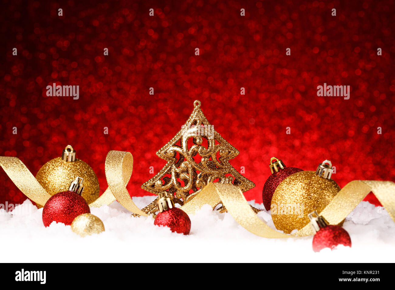 christmas fir tree decoration on red glitter background Stock Photo - Alamy