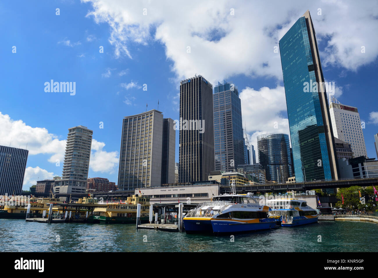 Ferry terminal on Circular Quay surrounded by high-rise buildings in Sydney Central Business District - Sydney, New South Wales, Australia Stock Photo