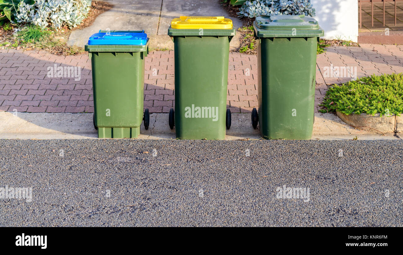 Kerbside waste bins ready for collection by local council in Australian suburb Stock Photo