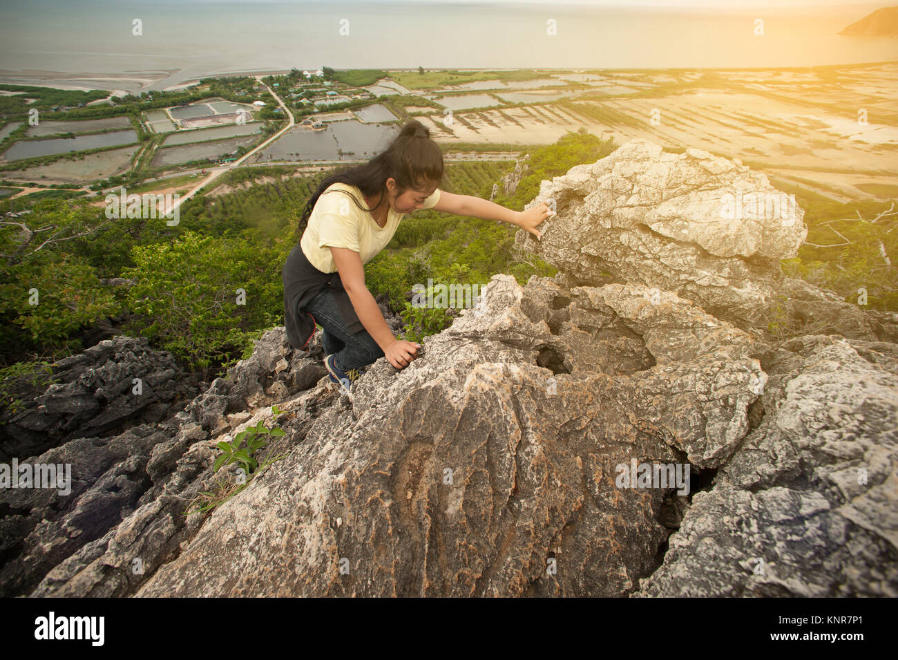 Pretty Asian woman hiking and climbing in mountains Stock Photo - Alamy