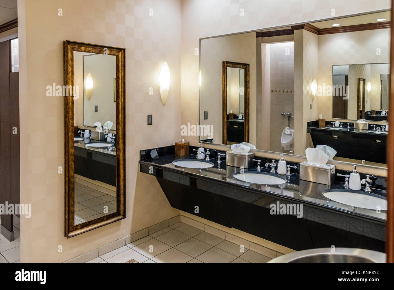 Interior of public men's bathroom or toilet in a luxury hotel, the Renaissance Hotel and Spa in Montgomery, Alabama, USA. Stock Photo