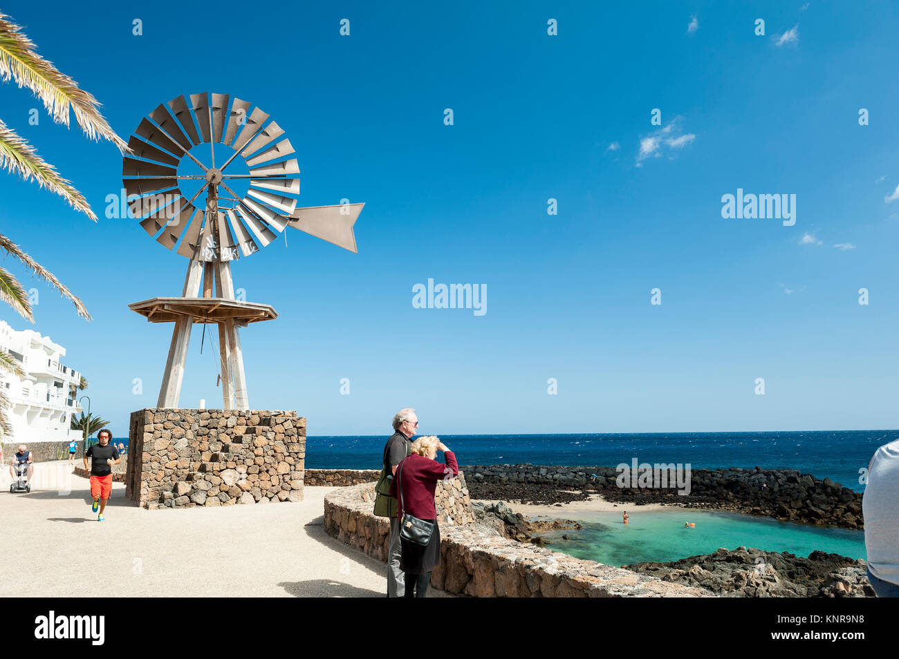 Windmill on a promenade in Costa Teguise, Lanzarote in the Canary Islands, Spain Stock Photo
