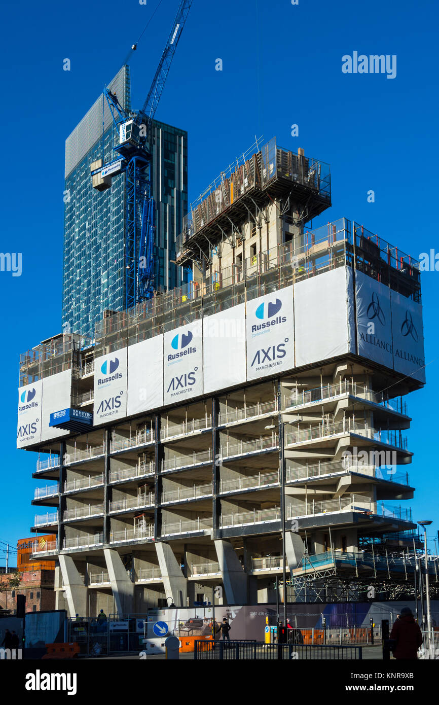 The Axis Tower apartment block development under construction with the Beetham Tower behind.  Whitworth Street West, Manchester, England, UK. Stock Photo