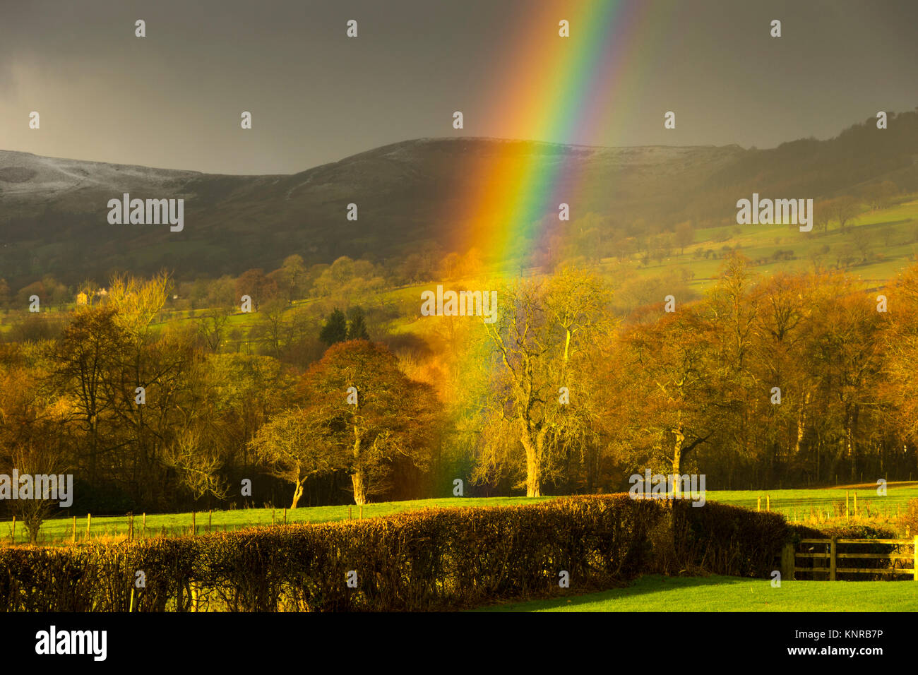 A rainbow over the Hope Valley from near Farfield Farm, near Hope village, Peak District, Derbyshire, England, UK Stock Photo