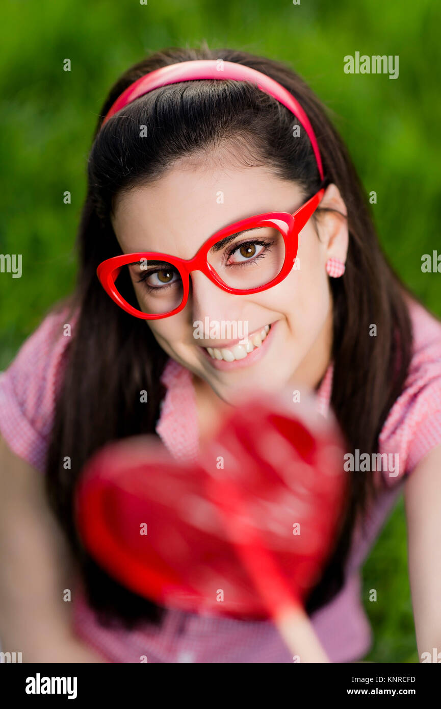 Frau mit Herzlolly - woman with heart Stock Photo