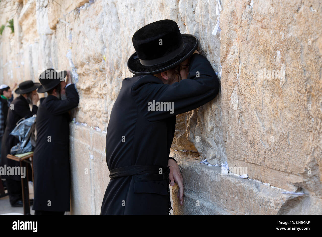 Jew praying in Jerusalem at man section of the Wailing Wall, the wall of the temple Stock Photo