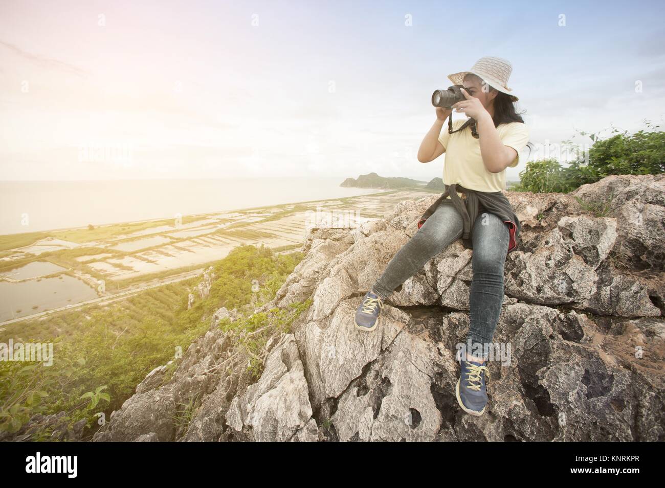 Pretty Asian woman hiking and climbing in mountains Stock Photo - Alamy