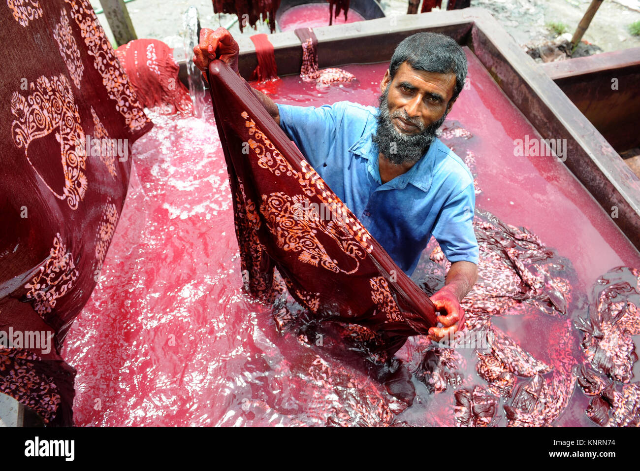 NARAYANGANJ, BANGLADESHJUNE 09, 2016 Bangladeshi workers wash fabrics