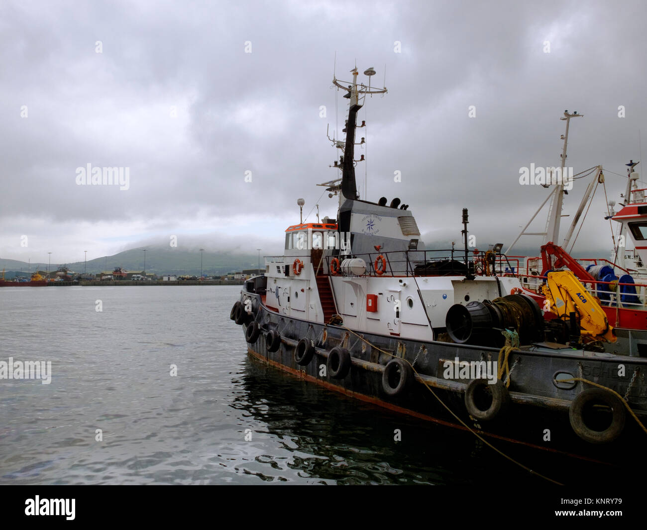 A fishing boat moored at Castletownbere on a wet stormy day, Southern Ireland. Stock Photo