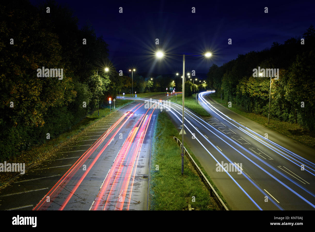A slowly exposed shot of cars at night on the A441 in Redditch Stock Photo