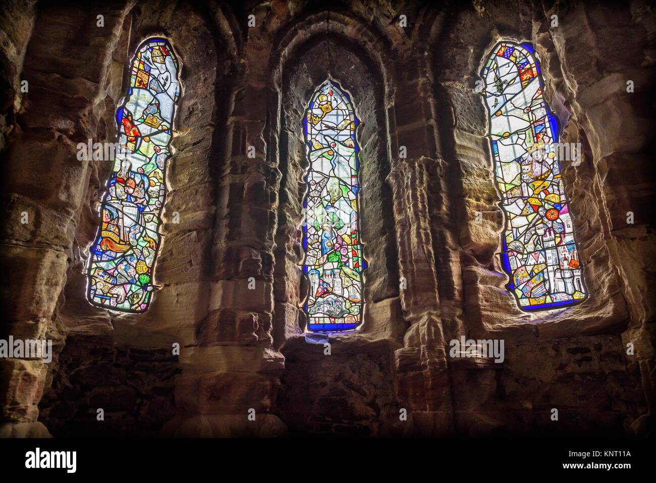 Stained glass windows inside The Royal Chapel of Conwy castle, Wales. Made by made by Linda Norris and Rachel Phillips. Stock Photo