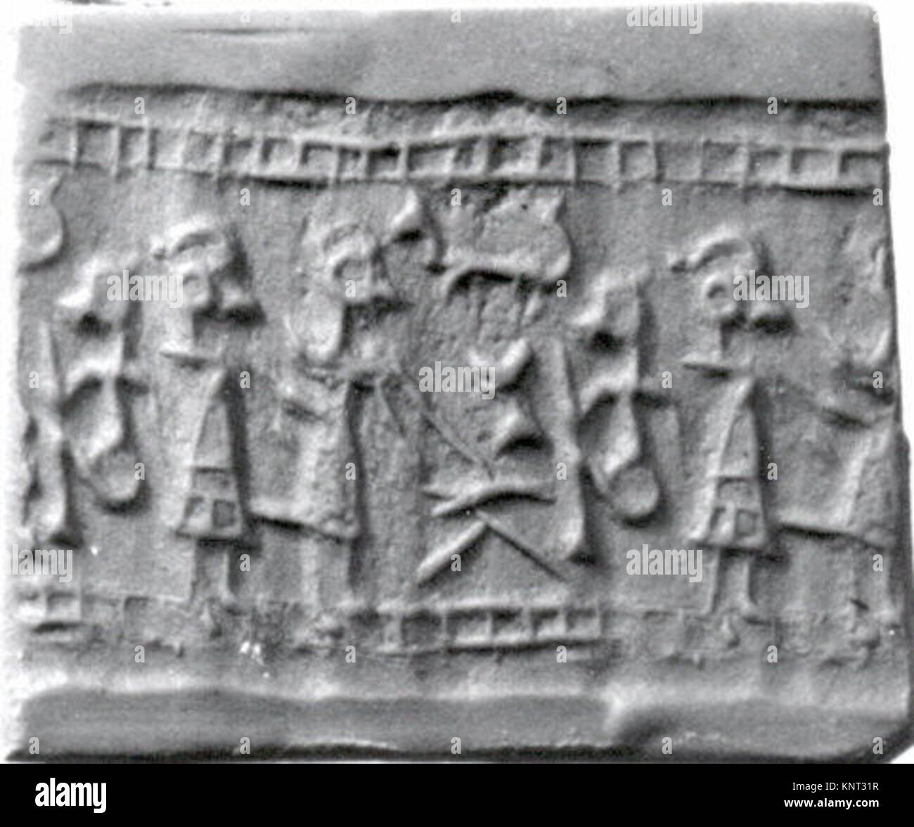 Cylinder seal and modern impression- figure seated at a table approached by two other figures MET ss43 102 36 323996 Stock Photo