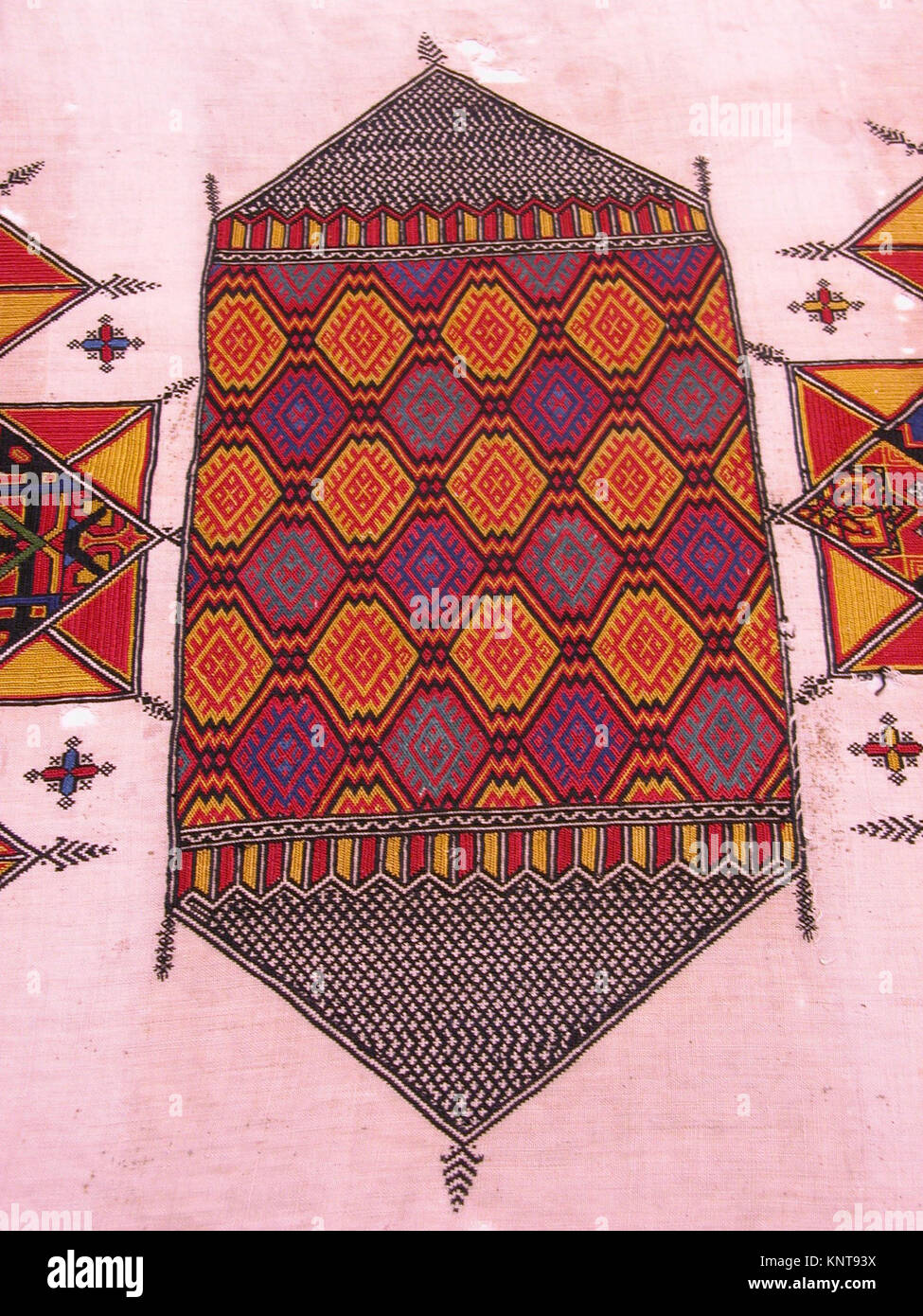 Perod Pattern A textile hanging labeled 'Arid,' featuring woven patterns and ...