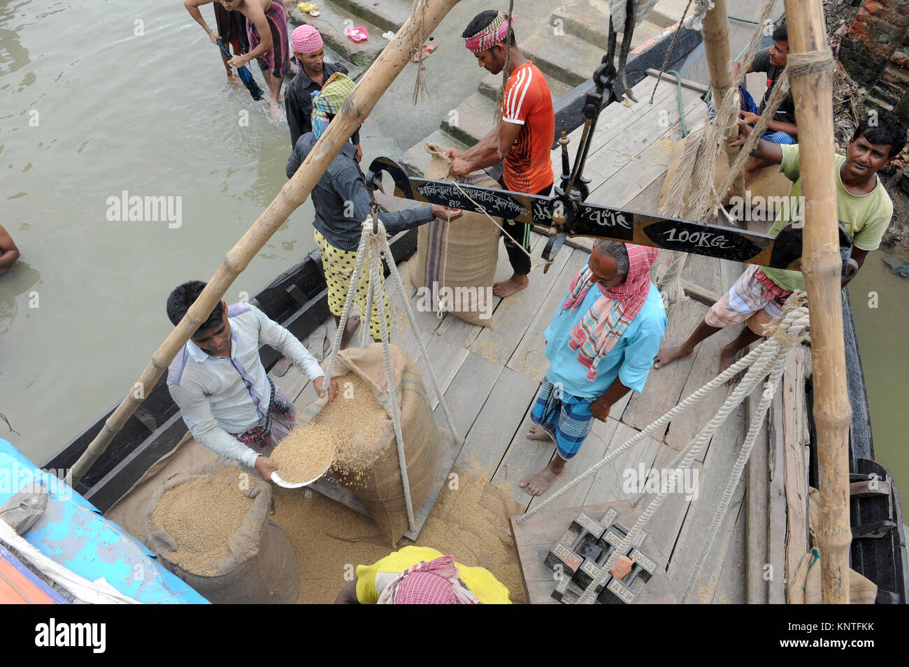 BRAHMANBARIA, BANGLADESHJUNE 10, 2016 A Bangladeshi trader measures