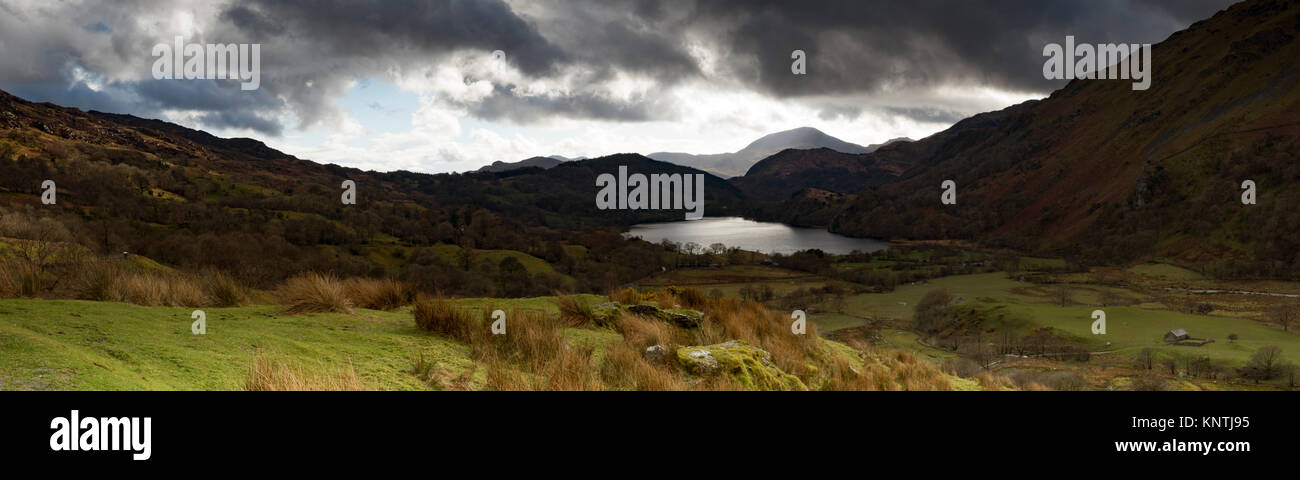 Panoramic view of an atmospheric Llyn Gwynant Valley and Lake, Snowdonia National Park, Wales. Stock Photo