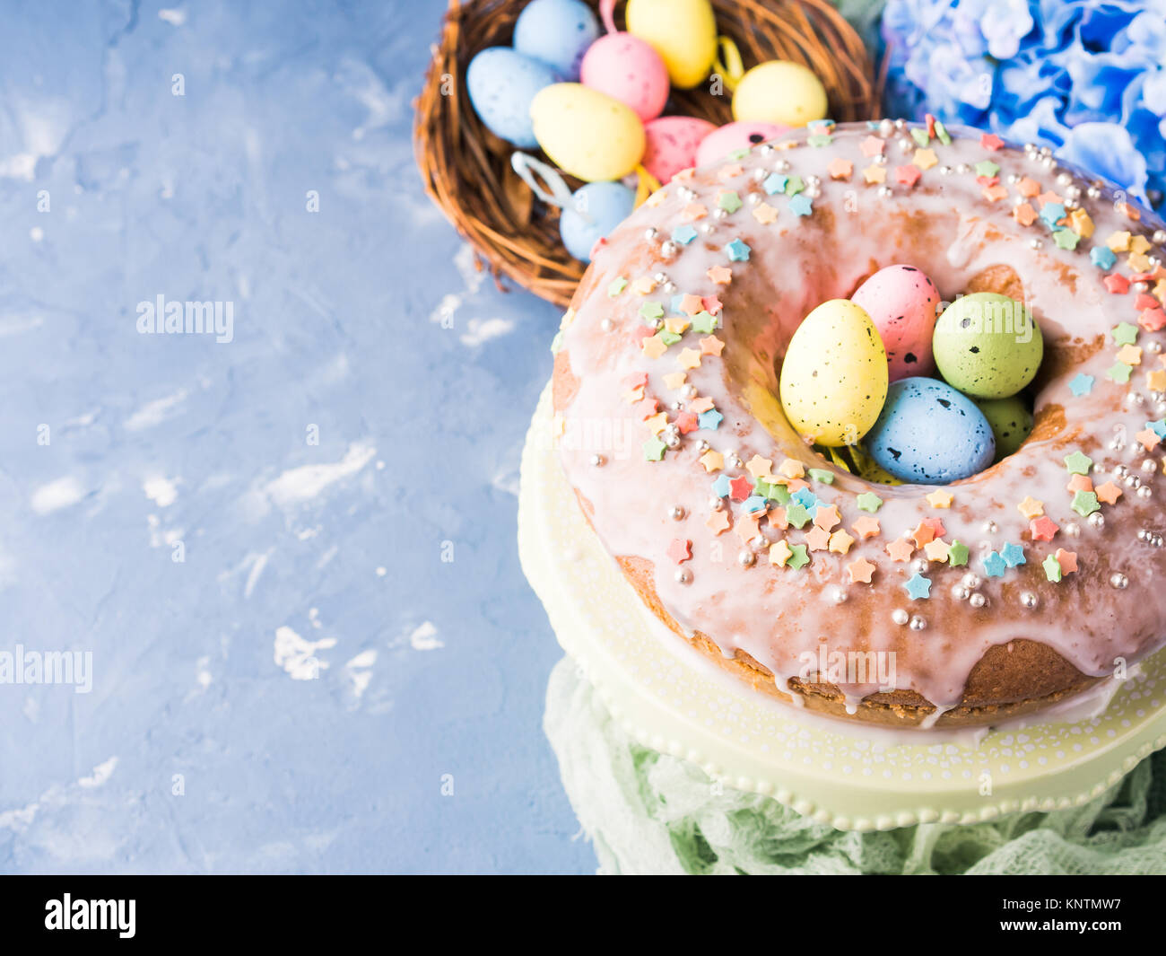 Easter bundt ring cake with sugar frosting sprinkles decorations eggs