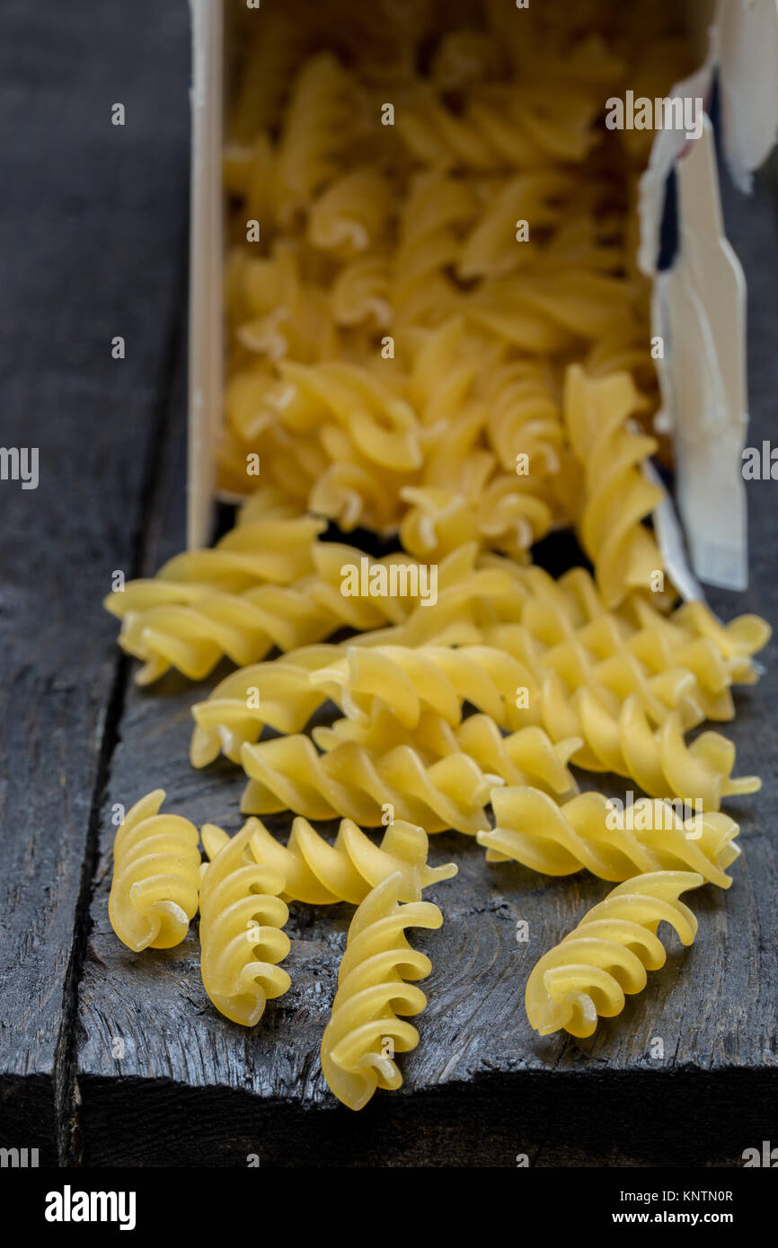 Fusilli noodle on dark rustic wood Stock Photo Alamy