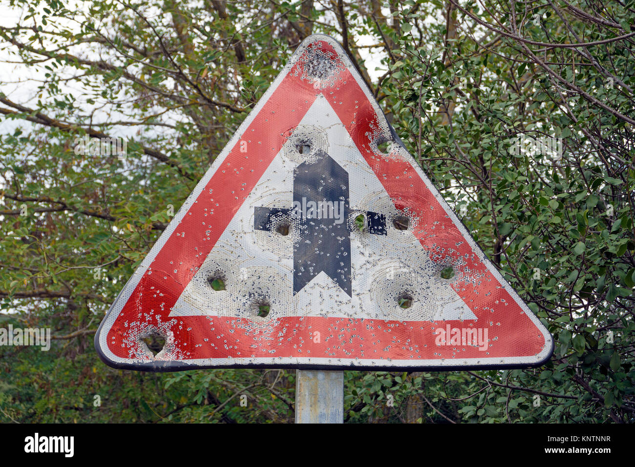 Riddled traffic sign at a road, Gallura, Sardinia, Italy, Mediterranean sea, Europe Stock Photo