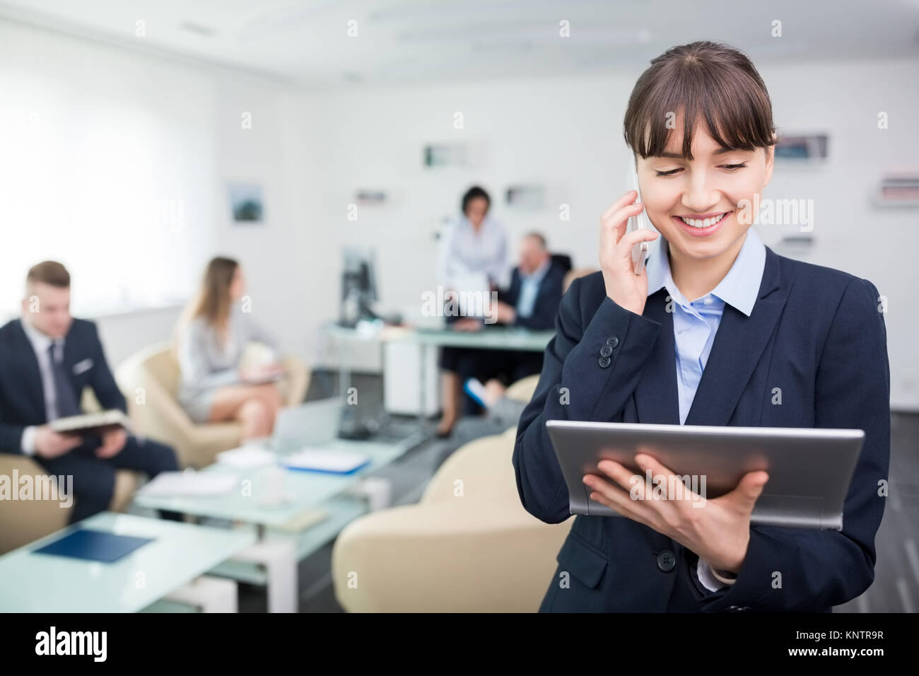 Business people talking using tablet hi-res stock photography and ...