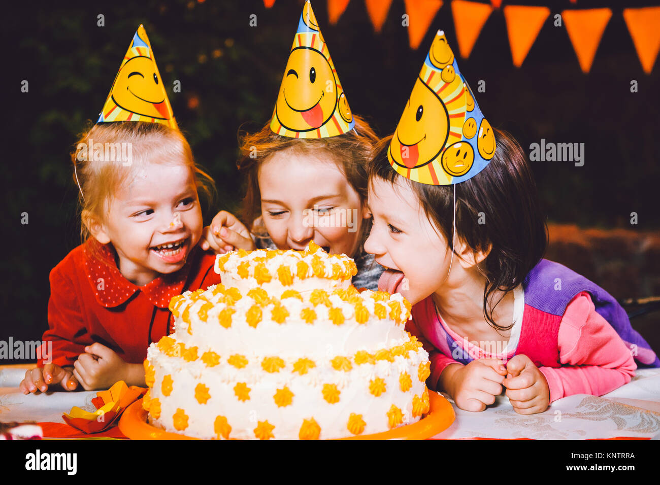 Children eating birthday cake hands hires stock photography and images