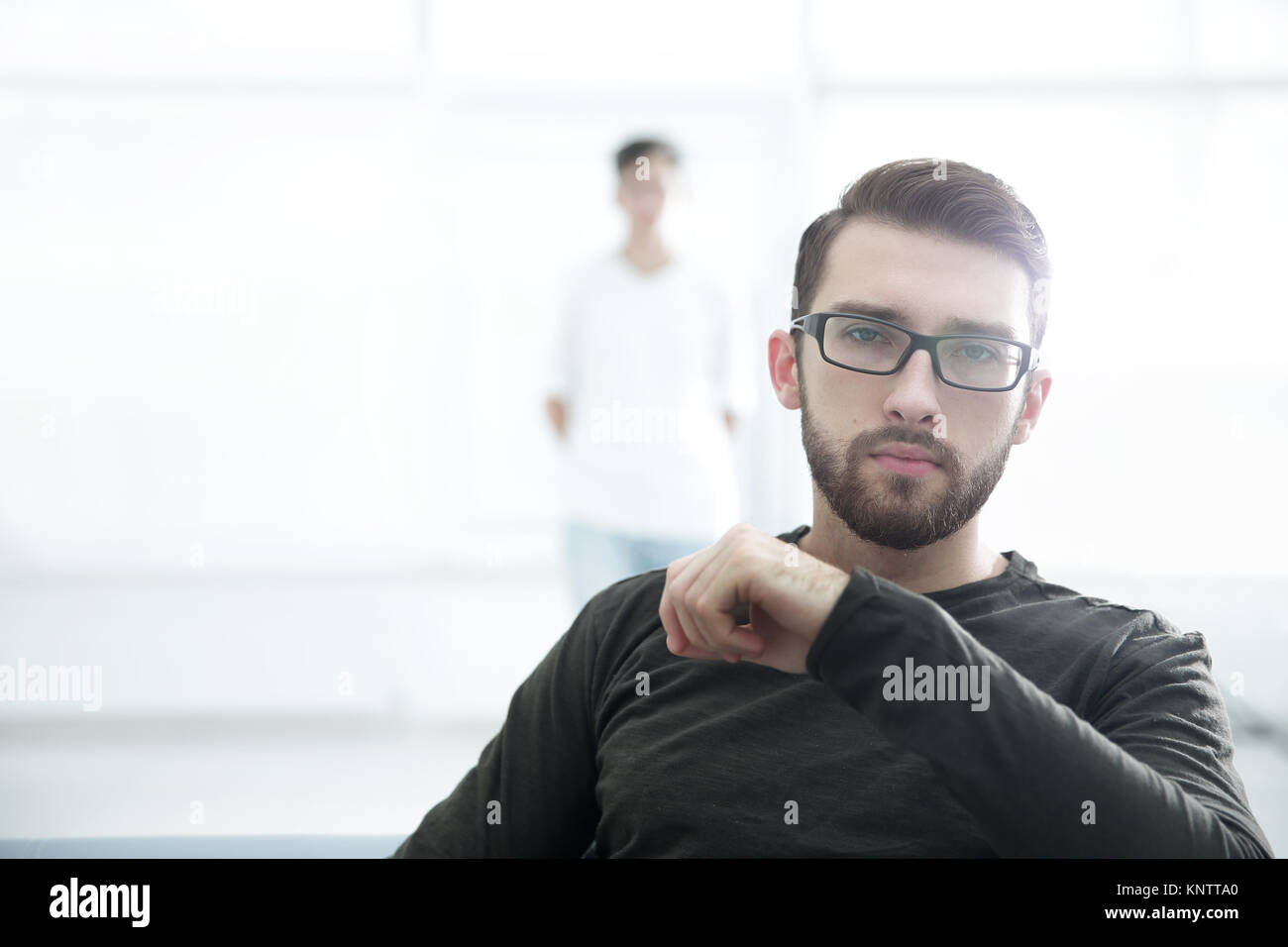 Handsome concentrated young man in glasses Stock Photo Alamy