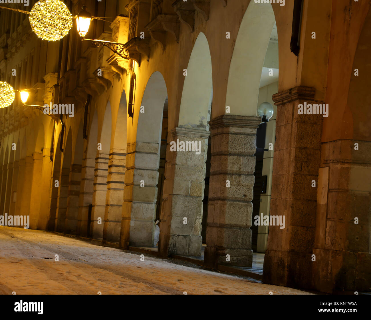 historical palace with Christmas lights in Vicenza city in Italy   with snow Stock Photo