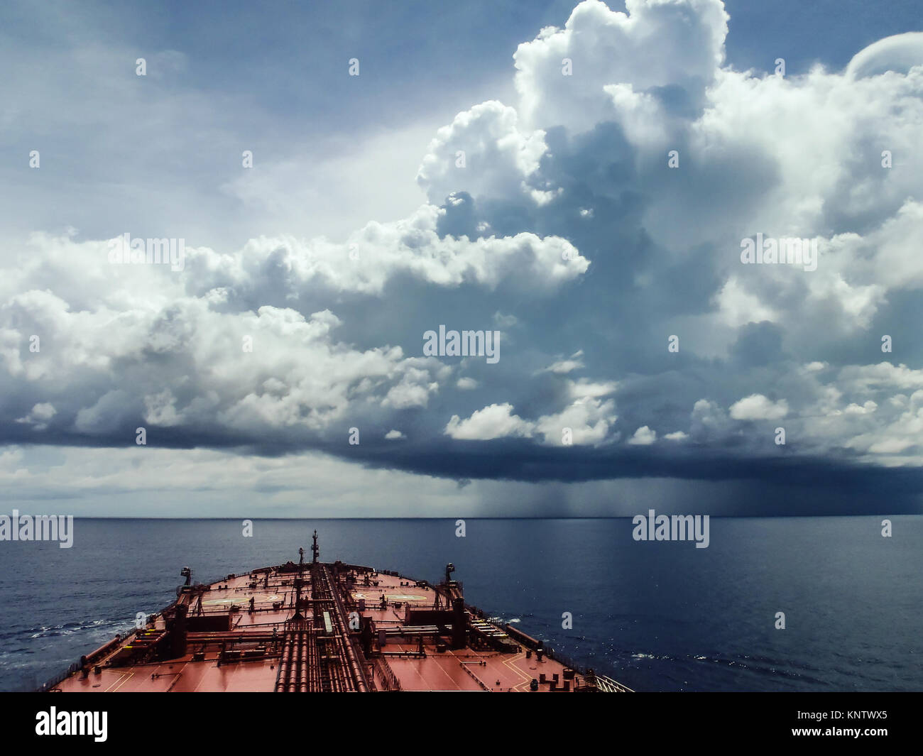 An oil tanker sails in the waters of Indian ocean facing a terrible storm Stock Photo