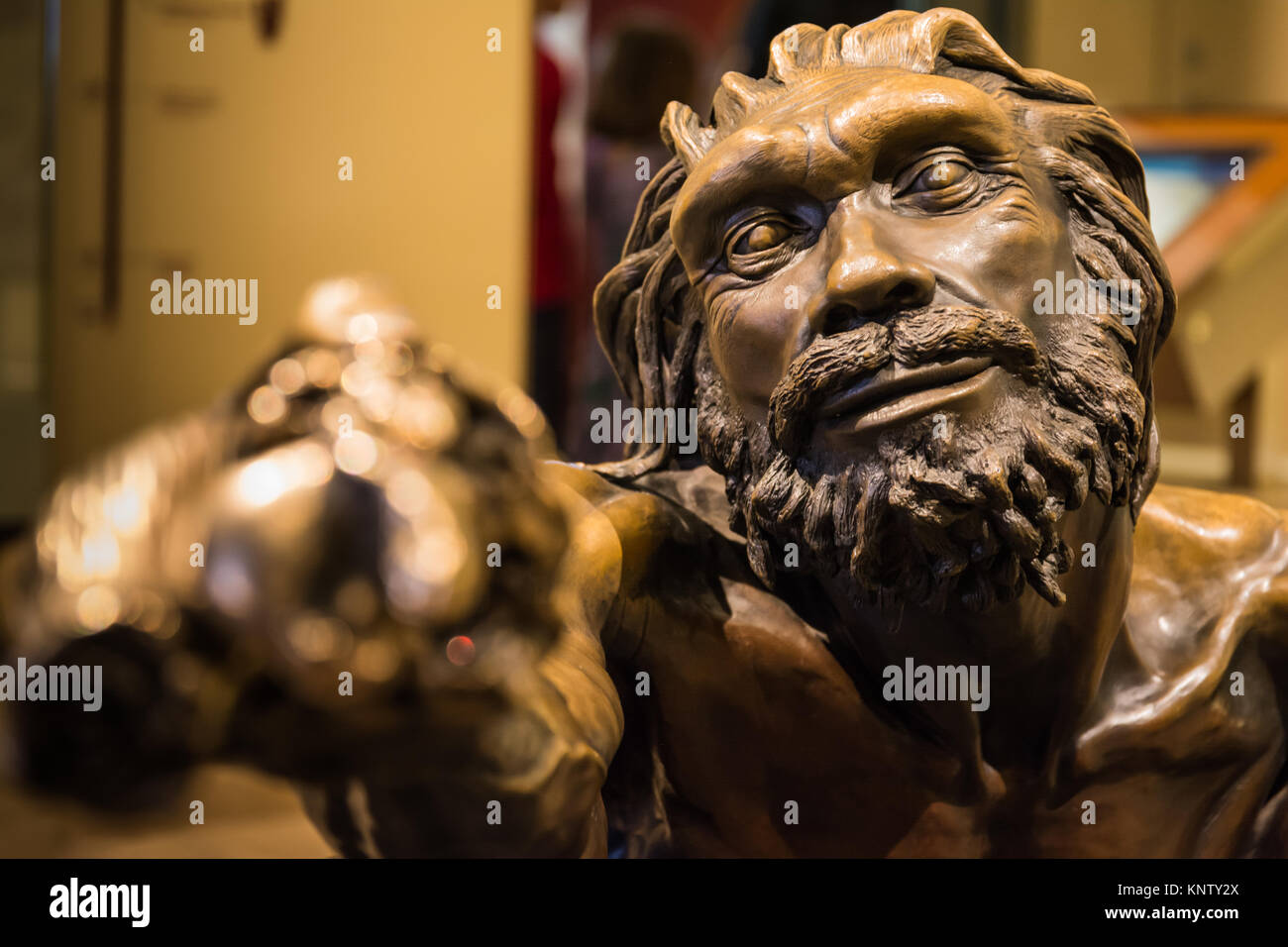 Primitive Man Holding Stick Statue Bronze Installation Feature History