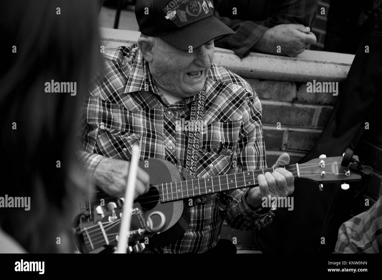 Monochrome photo of musicians playing outside in the street at the Friday Night Jamboree at Floyd Country Store in Floyd, Virginia, 24091, USA Stock Photo