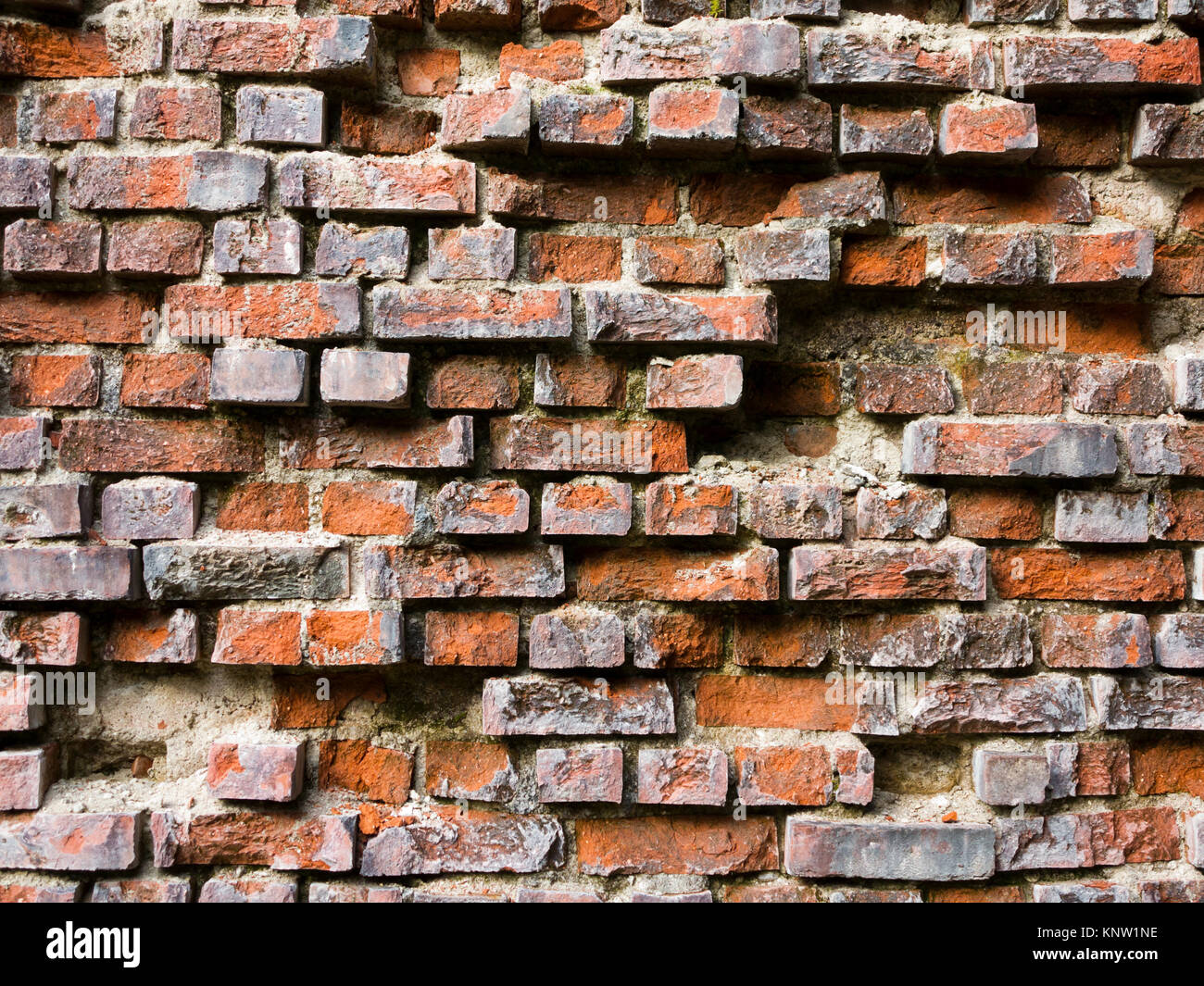 Old broken brick wall - brick texture Stock Photo