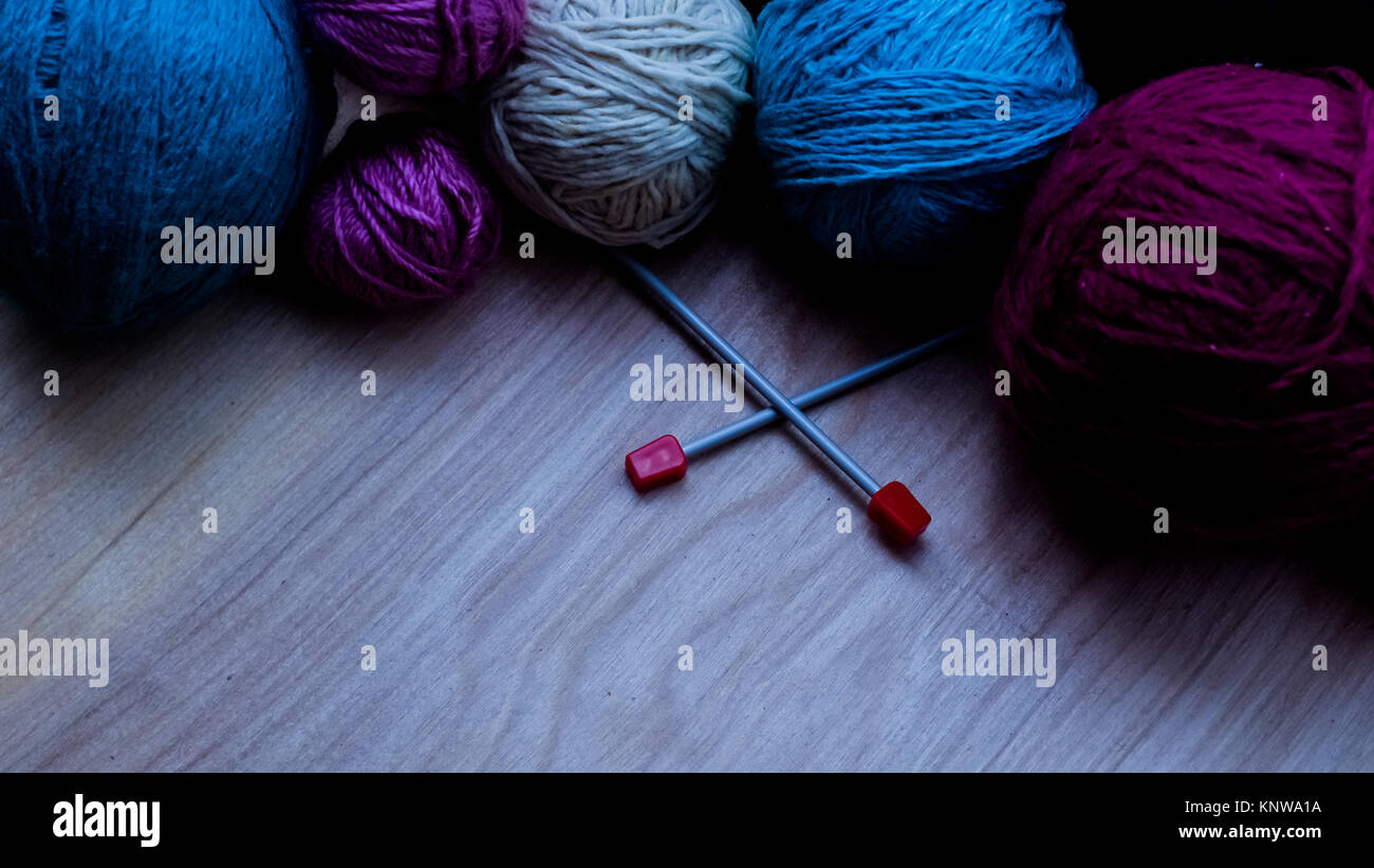 Balls of woolen yarn for knitting on the table Stock Photo - Alamy