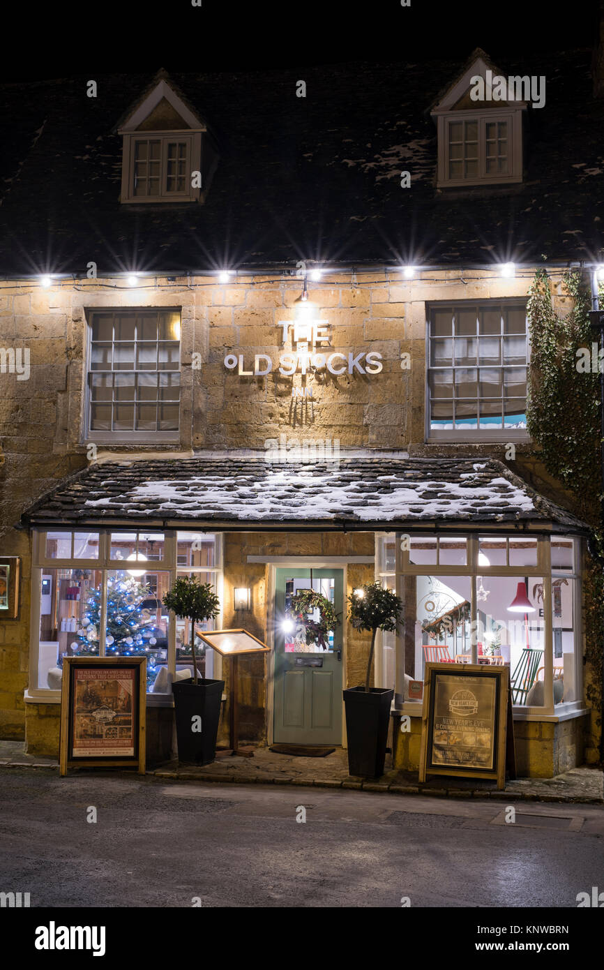 The Old stocks inn with a christmas tree and decorations at night. Stow on the Wold, Cotswolds, Gloucestershire, England Stock Photo