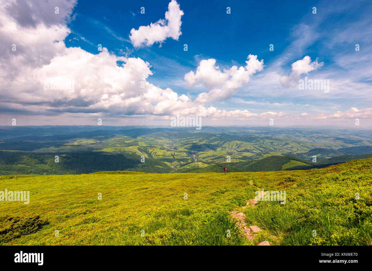 winding path through large meadows on the hillside of Carpathian mountain ridge Stock Photo