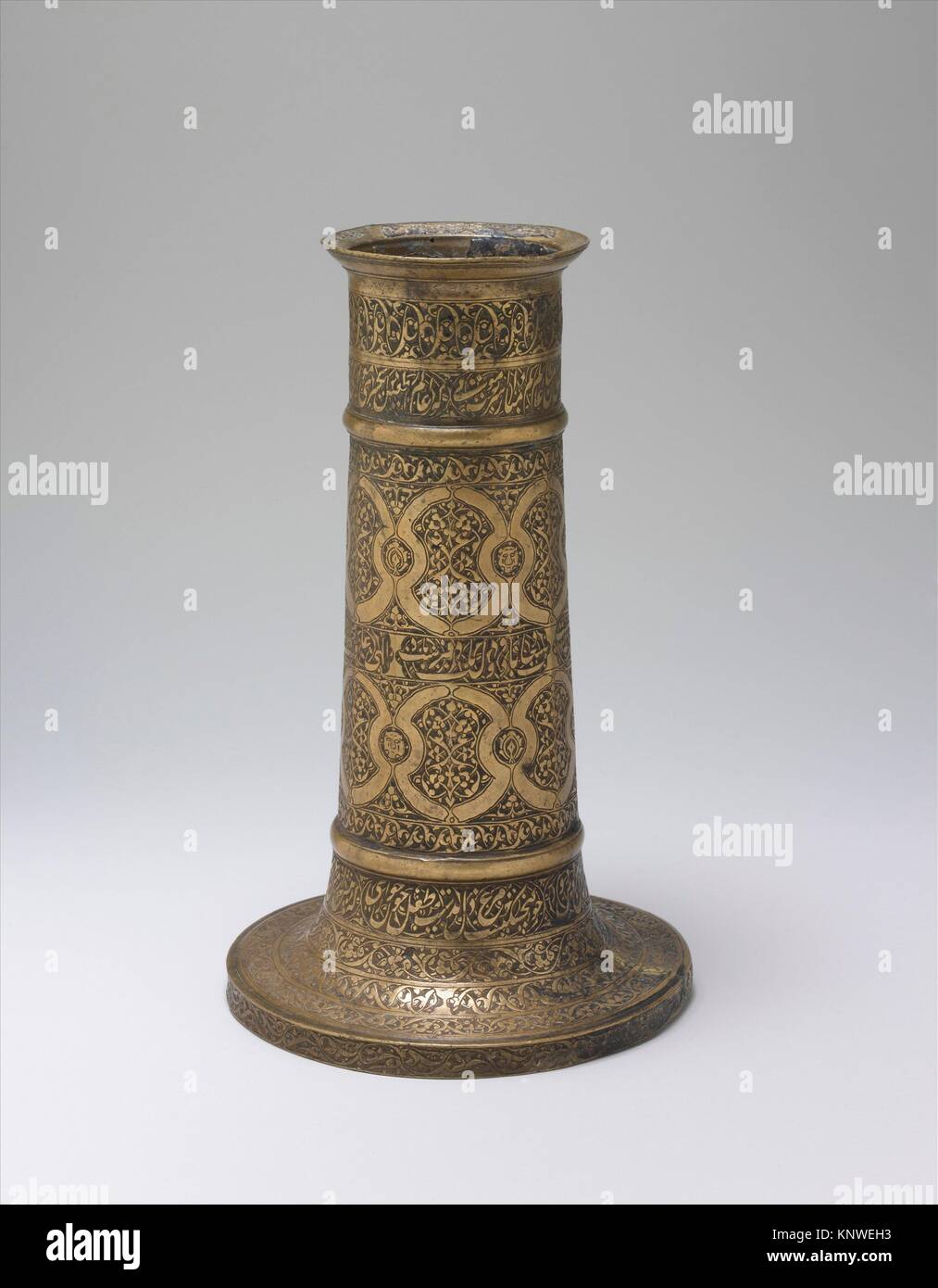 Engraved Lamp Stand with Interlocking Circles. Object Name: Lamp stand; Date: probably 16th century; Geography: Attributed to Iran; Medium: Brass; Stock Photo
