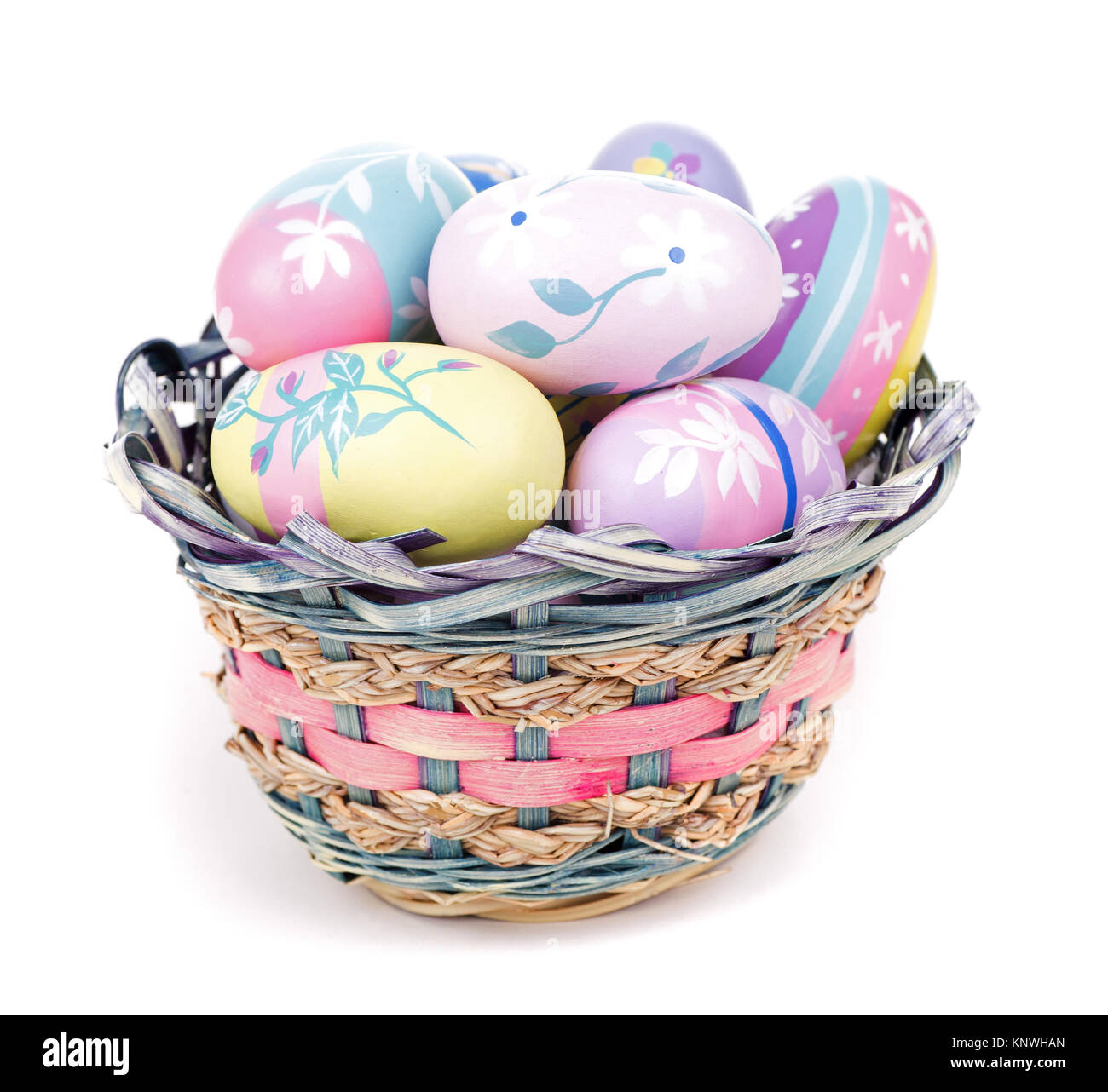 Basket of colorful Easter eggs on a white background Stock Photo - Alamy