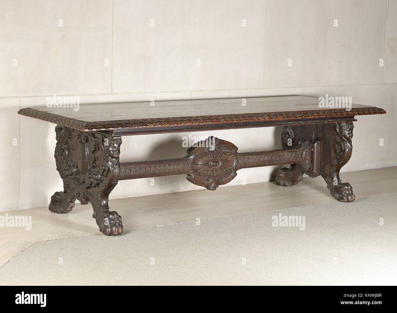 Center table. Date: 19th century, second half or early 20th century; Culture: Italian; Medium: Walnut, carved; Dimensions: H. 76.2 cm, W. 279.6 cm, Stock Photo