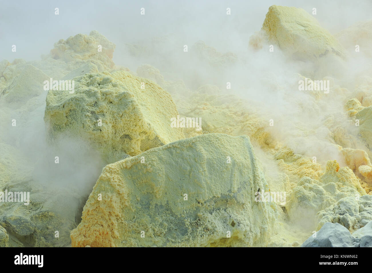 Clouds of sulphuric acid laden steam billow from active fumaroles and  deposit sulphur on lava rocks within the caldera of the Sierra Negra  Volcano. Is Stock Photo - Alamy